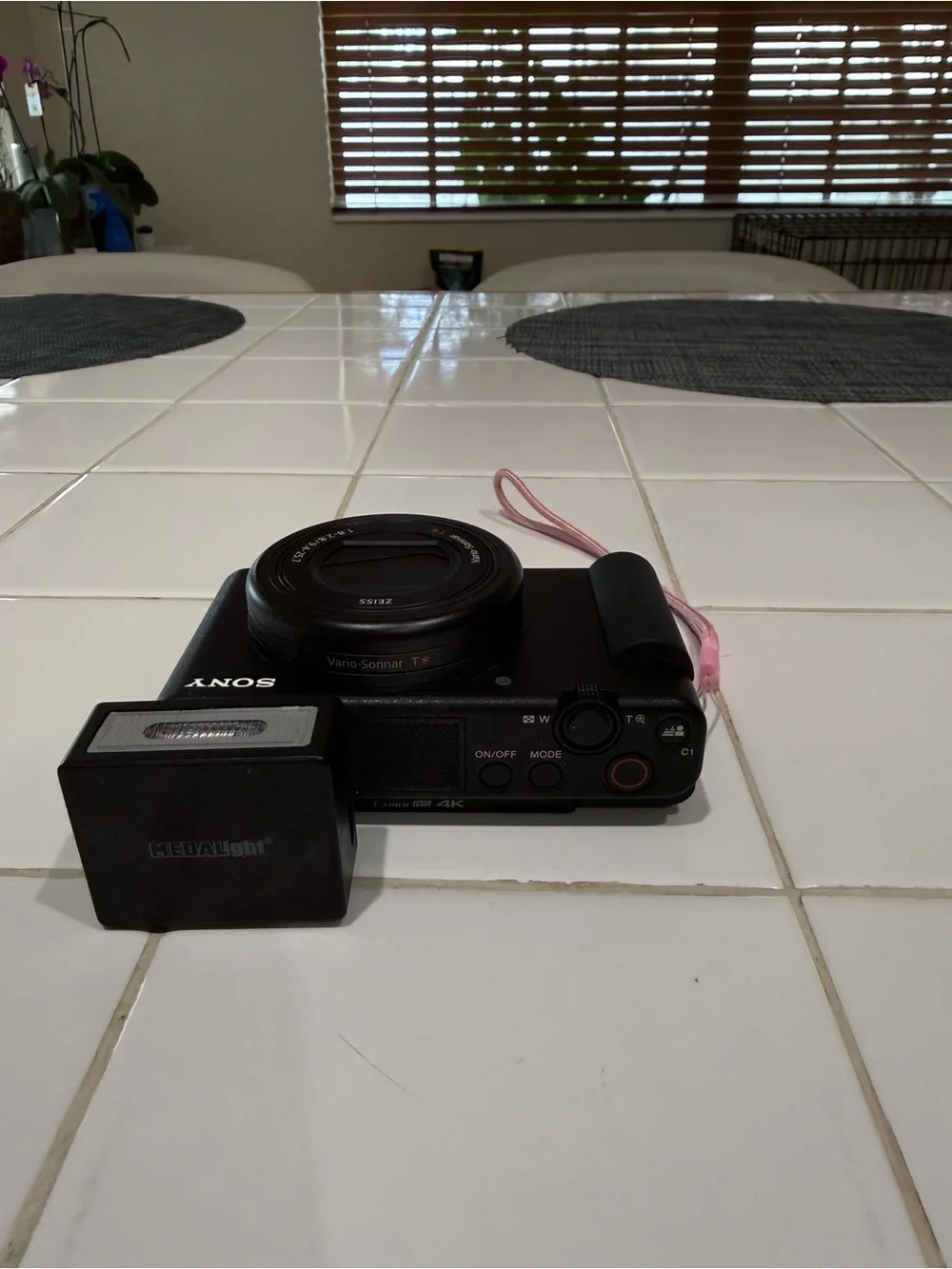 Sony Black Compact Digital Camera with Detachable Flash and Pink Strap